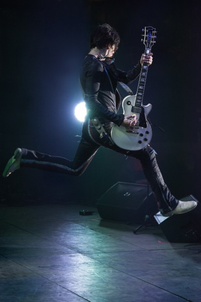 Justin Hawkins of the Darkness mid-jump at HOG Festival