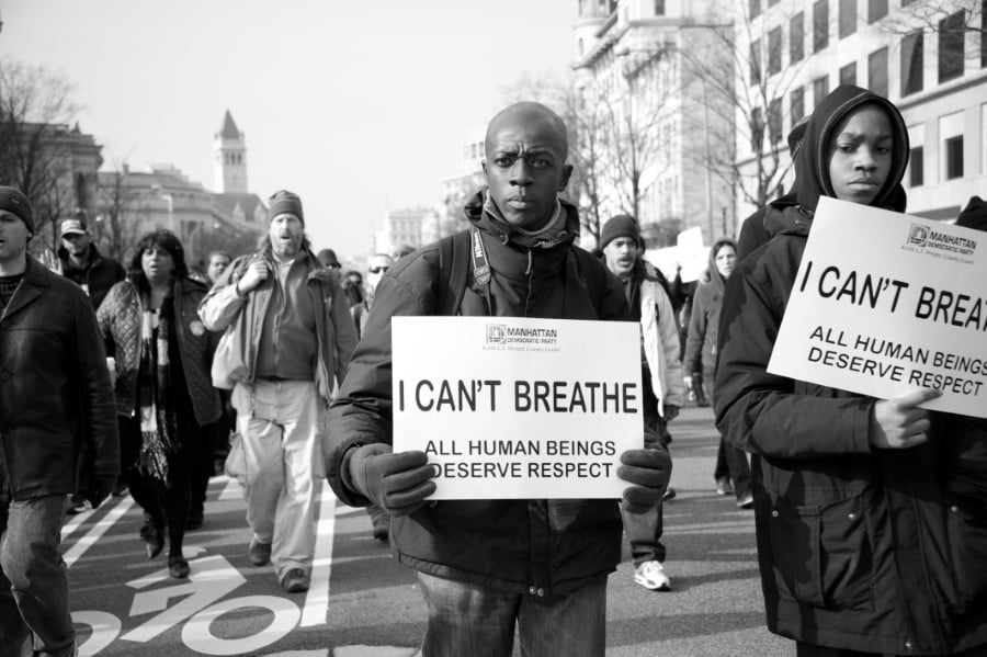 A photo of protesters marching against police shootings and racism during a rally in Washington, DC, on December 13, 2014