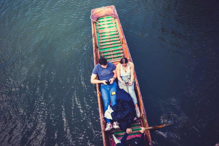 Photo showing a couple in a gondola from top-down perspective<