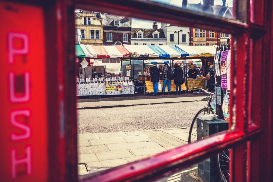  Photo of a street market taken from inside a telephone box<