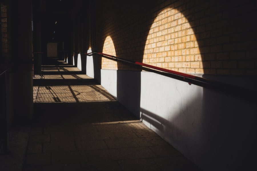  Photo of shadows and light on a brick wall<