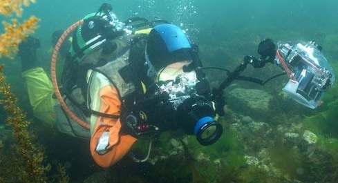 © Wex Photo Video Scuba diver using underwater camera in a river.jpg